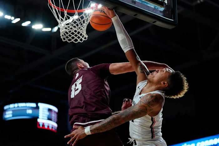 Cincinnati Bearcats guard Jeremiah Davenport (24) is fouled by Eastern Kentucky Colonels forward Dardan Kapiti (15) in the first half of the NCAA basketball game between the Cincinnati Bearcats and the Eastern Kentucky Colonels at Fifth Third Arena in Cincinnati on Sunday, Nov. 13, 2022. Eastern Kentucky Colonels At Cincinnati Bearcats Basketball
